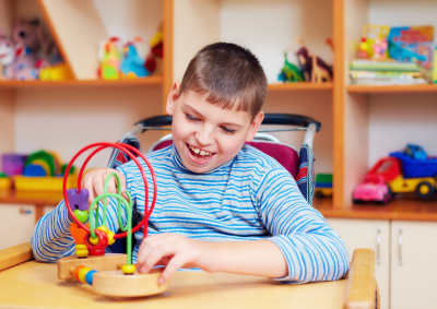 boy with special needs receives occupational therapy